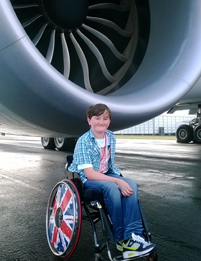 Wheelchair user with plane image